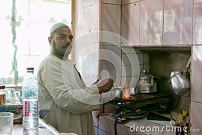 Egyptian man preparing traditional coffee Editorial Stock Photo