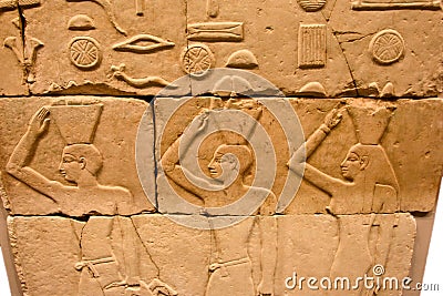 Egyptian relief with three offering people Editorial Stock Photo