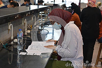 Egyptian Students wearing masks and taking final year exams with precautionary and strict measures amid coronavirus pandemic Editorial Stock Photo