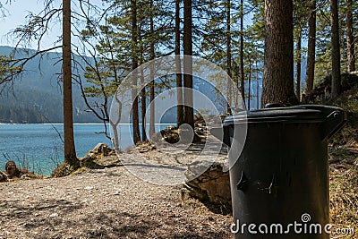 Eibsee, Germany, March 31, 2019: trash can next to the seeweg loop track. The trash cans are spread all over the place to keep it Stock Photo