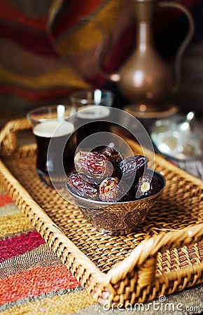 Eid mubarak with arabic coffee pot and dates. Dried dates and coffe Stock Photo