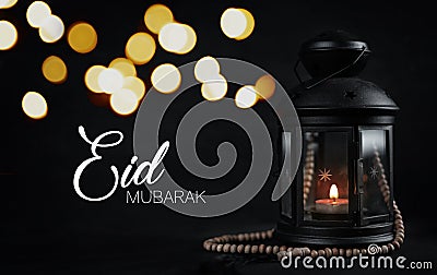 Eid Mubarak Greeting Typography Beautiful Bokeh. Ramadan Candle Stock Photo