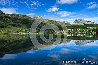 Eidsvatnet lake surrounded by hills reflecting on the water under the sunlight in Norway Stock Photo