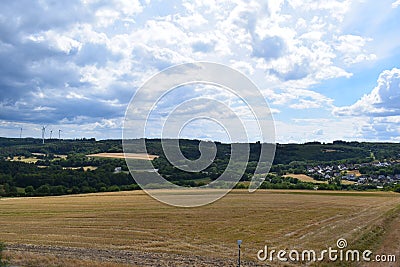 Kaisersesch, Germany - 07 26 2022: Wind power plants close to town Stock Photo
