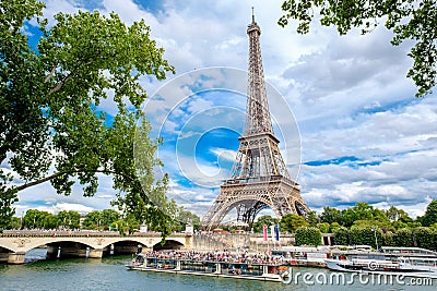 The Eiffel Tower and cruise boats on the river Seine in Paris Editorial Stock Photo