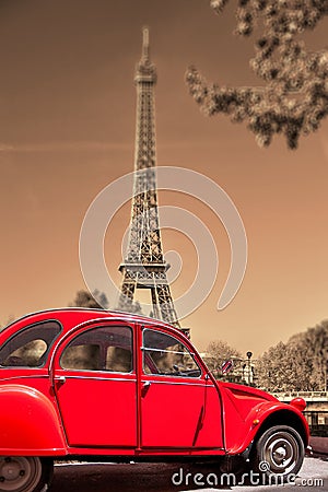 Eiffel Tower with old red car in Paris, France Stock Photo