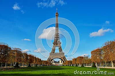 Eiffel tower over blue sky. Sunny autumn day in Paris Editorial Stock Photo