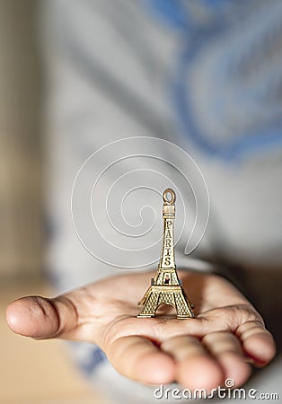 The Eiffel Tower in the palm of your hand Stock Photo