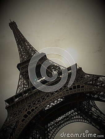 Eiffel Tower in Paris France with Cloud Cover on a Sunny Day Stock Photo