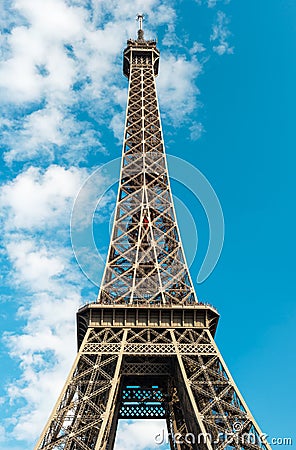 Eiffel Tower in Paris over cloudy blue sky Stock Photo