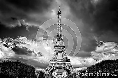 Eiffel Tower seen from Champ de Mars park in Paris, France. Black and white Stock Photo