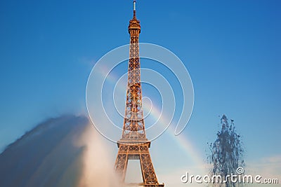 Eiffel Tower seen from fountain making natural rainbow, Paris, France Stock Photo