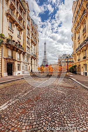 Eiffel Tower seen from the street in Paris, France. Cobblestone pavement Stock Photo