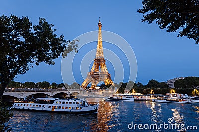 Eiffel Tower and Seine River by Night Editorial Stock Photo