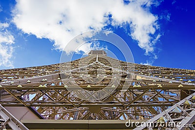 Eiffel tower under clouds and blue sky Stock Photo