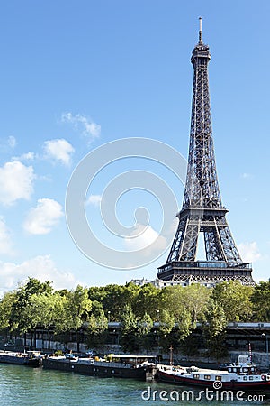 Eiffel Tower vertical landscape, river seine and boats Stock Photo