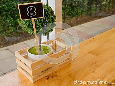 Eight number made from wood, vintage style on the table in coffee shops. Stock Photo