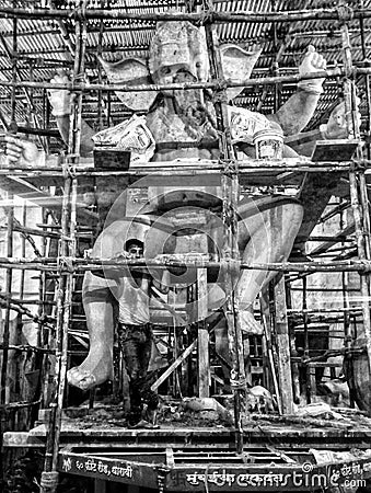 Eighteen feet lord Ganesha idol with the who making it. Stock Photo