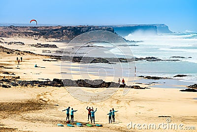 Unknown kitesurfers on a beach in El Cotillo village in Fuerteventura island, Sp Editorial Stock Photo