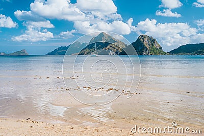 El Nido, Palawan,Philippines. Yacht boat in lagoon of Las Cabanas Beach with amazing mountains in background Stock Photo