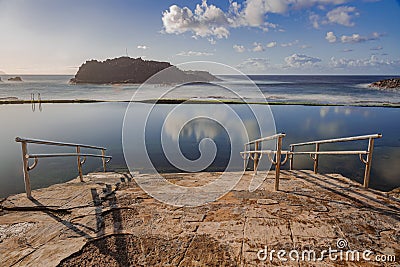 El Pris ocean pool and wall with green moss, Tenerife Stock Photo