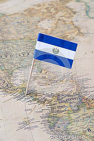 El Salvador flag pin on a world map Stock Photo