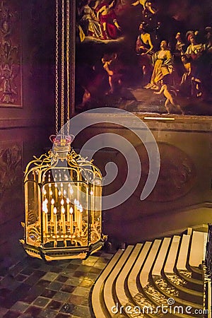 Elaborate gilded chandelier inside Hampton Court Palace Editorial Stock Photo