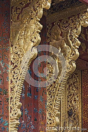 Elaborate gilded eave brackets, Temple Wat Xieng Thong,Luang Prabang, Laos Stock Photo