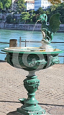 Elaborate green drinking fountain with dragon spout Stock Photo