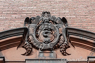 Elaborately carved stone entry pediment, architectural ornament Stock Photo