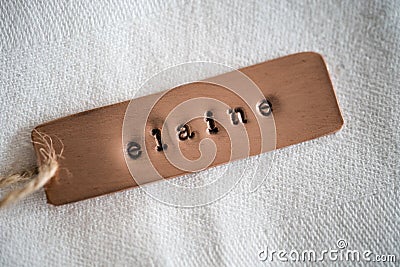 Elaine identity engraved name dog tag copper metal name plate badge Stock Photo