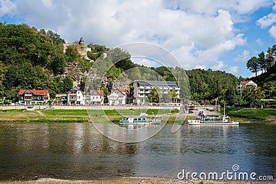 Elbe river and Rathen city skyline with Ferryboat - gateway to Bastei Bridge (Basteibrucke) - Saxony, Germany Editorial Stock Photo