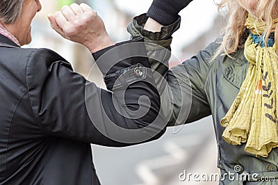 Elbow bump. Novel greeting to avoid spread of coronavirus Stock Photo