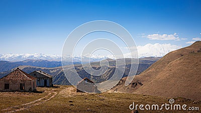 Elbrus And Green Hills with road At Sunny Summer Day. Dzhili-Su, Republic of Kabardino-Balkaria,North Caucasus, Russia. Stock Photo