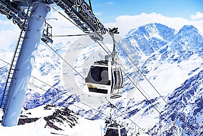 ELBRUS, RUSSIA - APRIL 12, 2018: Cable car ferrying passengers up and down the mountain Editorial Stock Photo