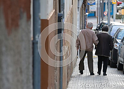 An elder couple walk downtown Palma de Mallorca Editorial Stock Photo