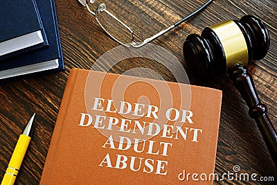 Elder or dependent adult abuse book and gavel. Stock Photo