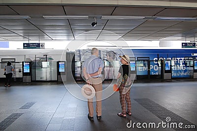 Elder foreign waits for skytrain at Siam Station Editorial Stock Photo