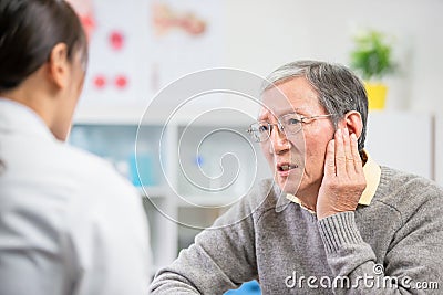 Elder patient feel earaches Stock Photo