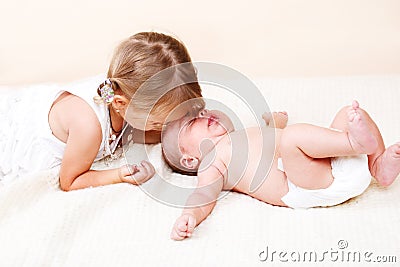 Elder sister and newborn brother Stock Photo