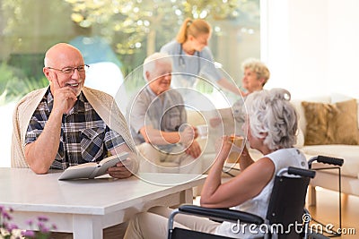 Elder talking to woman Stock Photo