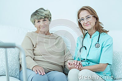 Elder woman and caring doctor Stock Photo