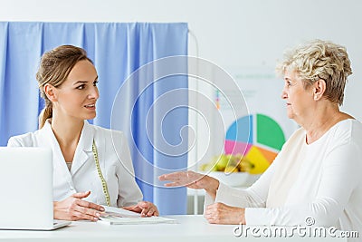 Woman talking about dietary supplements Stock Photo