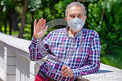 Elderly Casual Men with Face Mask in Park is Weaving Stock Photo