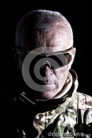 Elderly commando fighter studio portrait on black Stock Photo