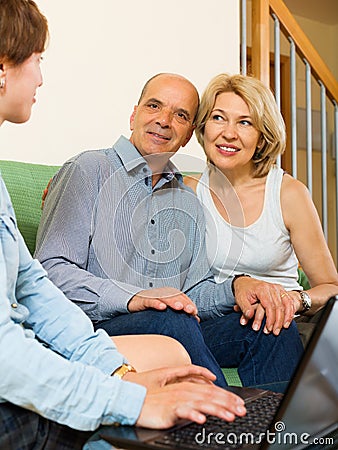 Elderly couple answer questions of social worker Stock Photo