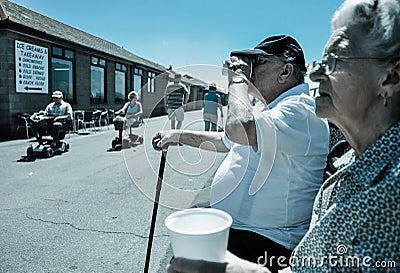 Elderly Couple drinking cups of tea on the English Seaside Editorial Stock Photo