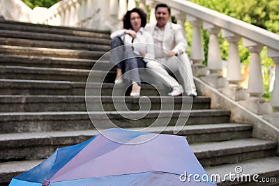 Elderly couple female male love happy middle-aged umbrella summer park Stock Photo