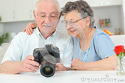 Elderly couple with high speed camera Stock Photo