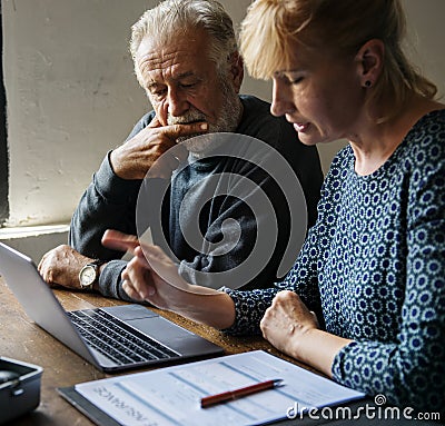Elderly couple researching information online Stock Photo